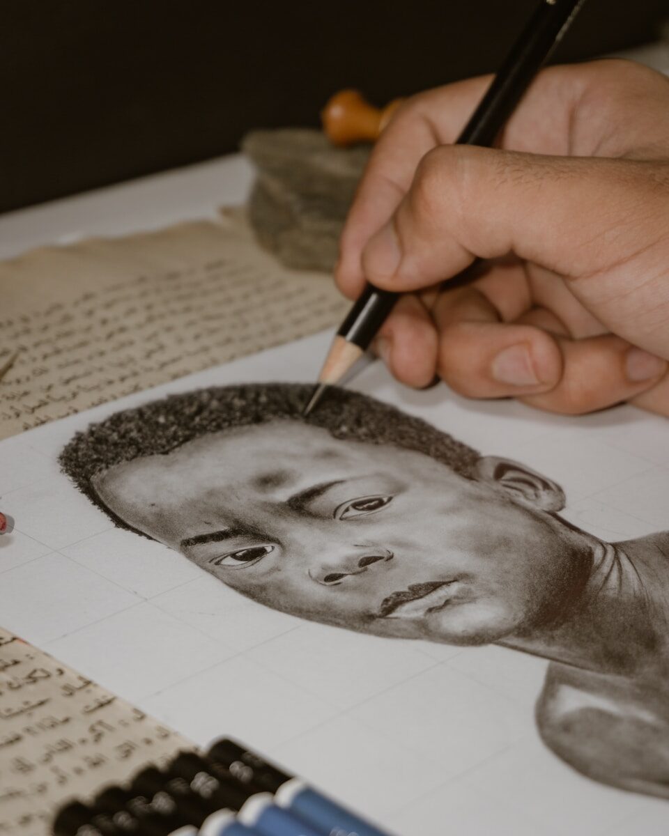 a drawing of a man's face on a piece of paper